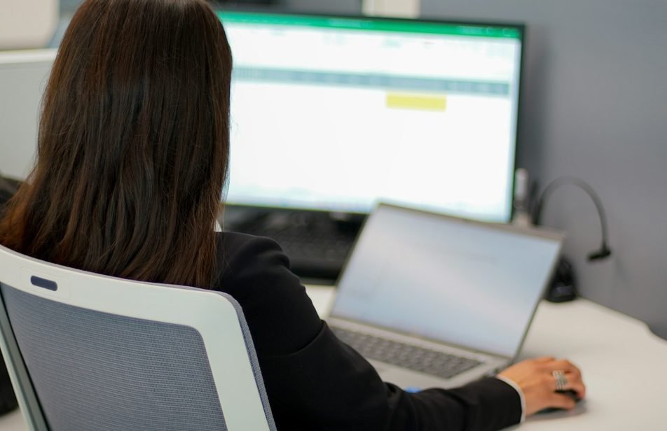 Accountant reviewing payroll and PF figures on a computer screen