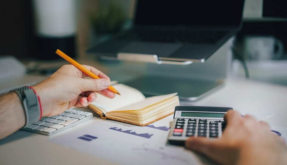 Desk notes and calculator for registration and accounts work